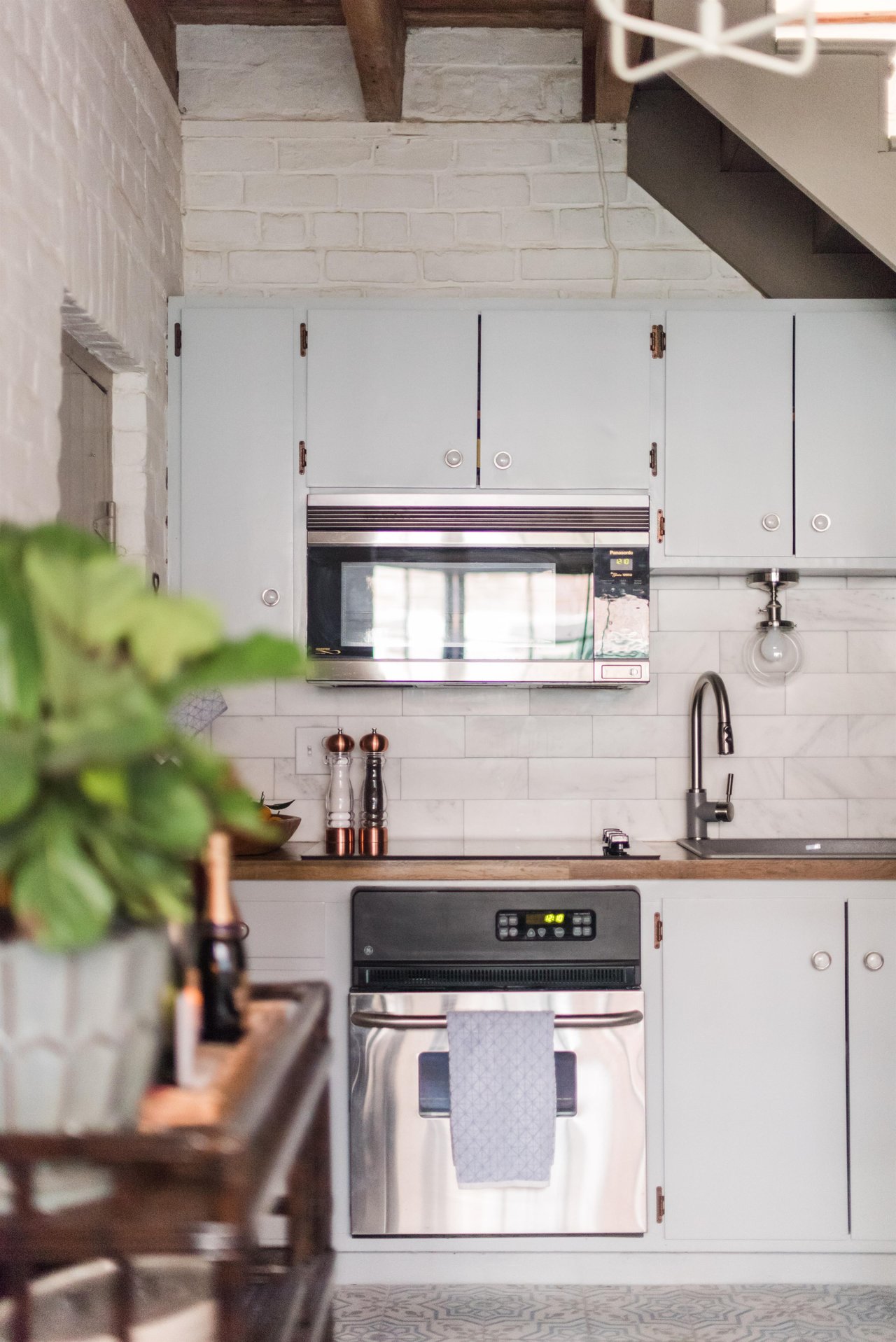 Modern appliances with charming furnishings tie this serene cottage together.