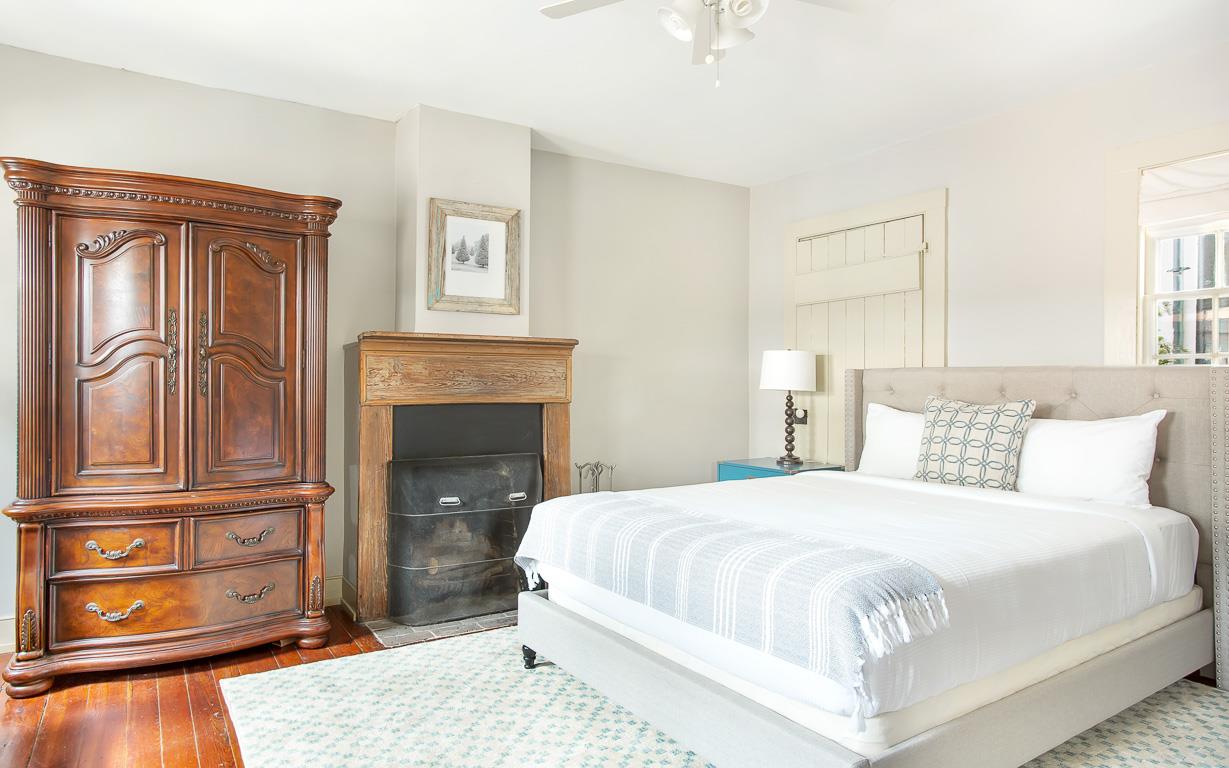 The original fireplace has been preserved to its natural state  A true highlight of this room