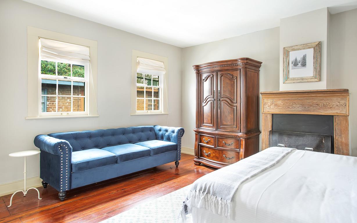 A large armoire offers additional space to hang or store your belongings.