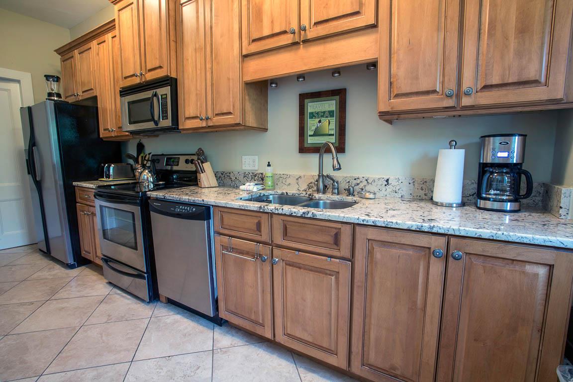 Granite counter tops and stainless steel appliances.