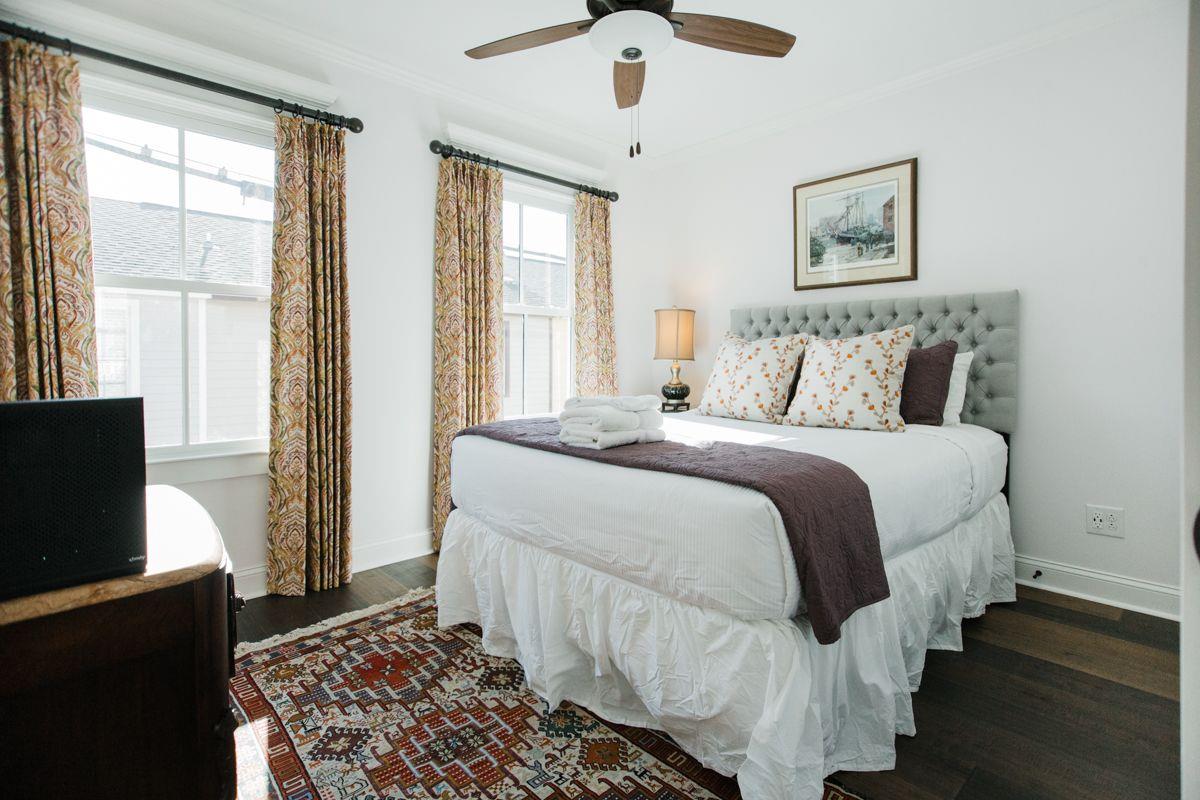 The plush queen bed is complimented with the white linens that are medically grade pressed.