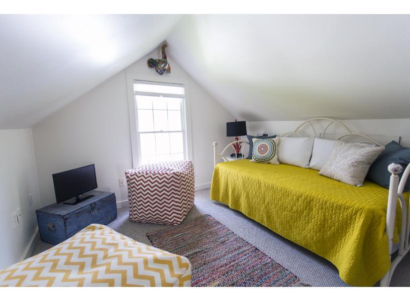 Light filled second story room with daybed