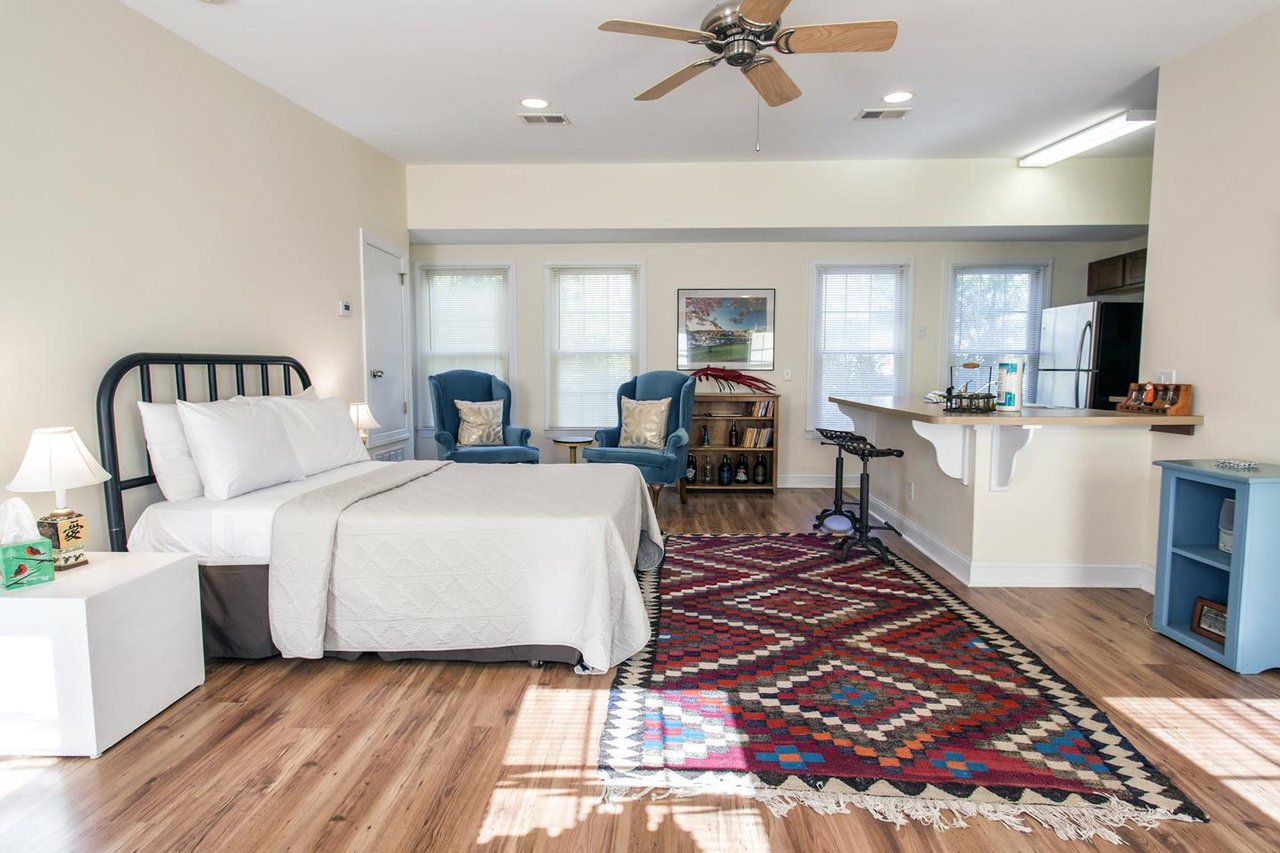 The carriage house is on the second floor of the garage. It is a studio space with a Queen size bed.