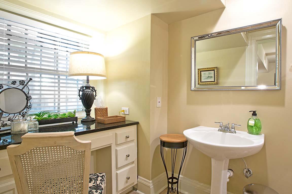Convenient bathroom with a vanity to get ready for the night.