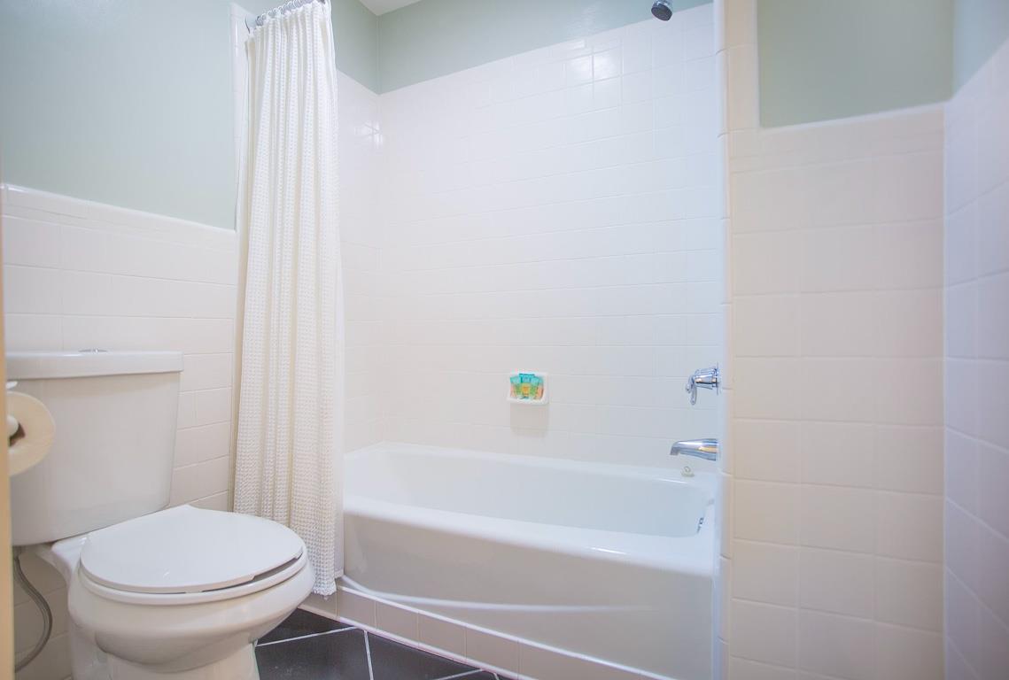 A tubshower combo can be found in the bathroom.