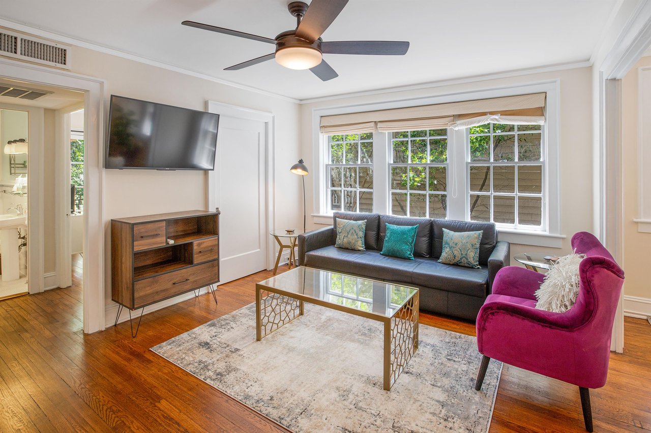 Located on the second story of this historic apartment building, the space boasts with natural light.