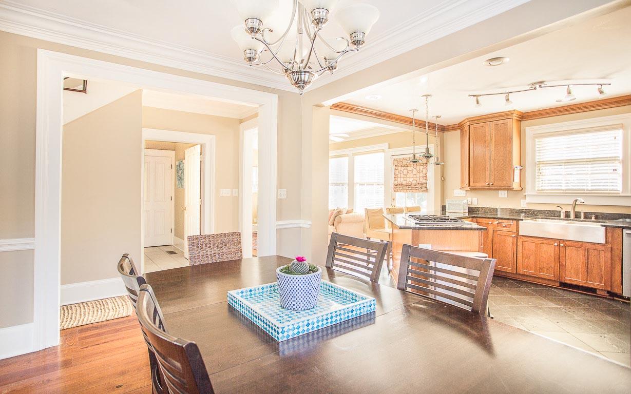 The dining table can seat six and is open to the kitchen.