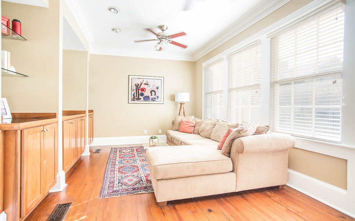 The casual living room is tucked behind the kitchen.