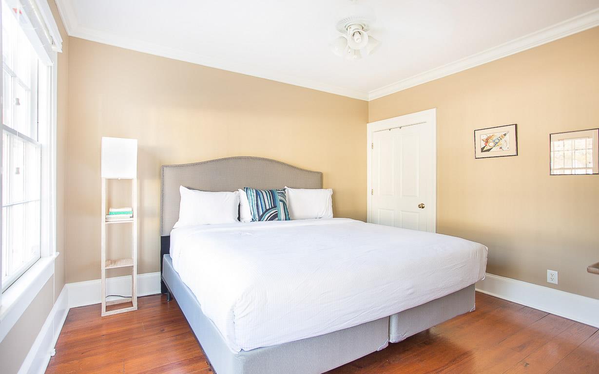 A groundlevel guest room has a King size bed.