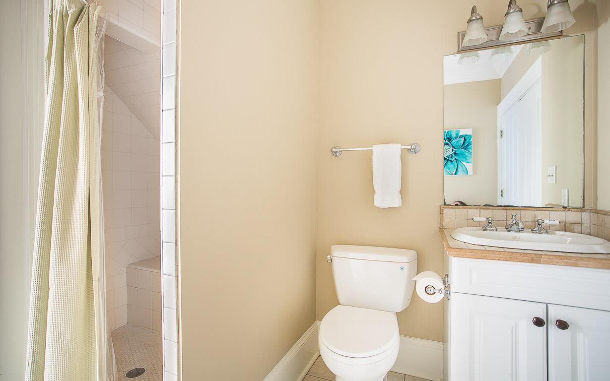 A full bath with builtin shower bench is convenient for ground level guests.