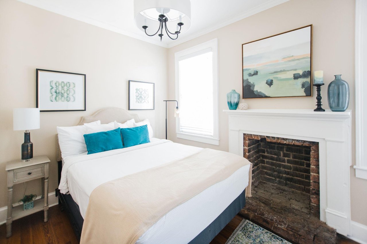 Calm accents, and a now decorative fireplace tie this room together.