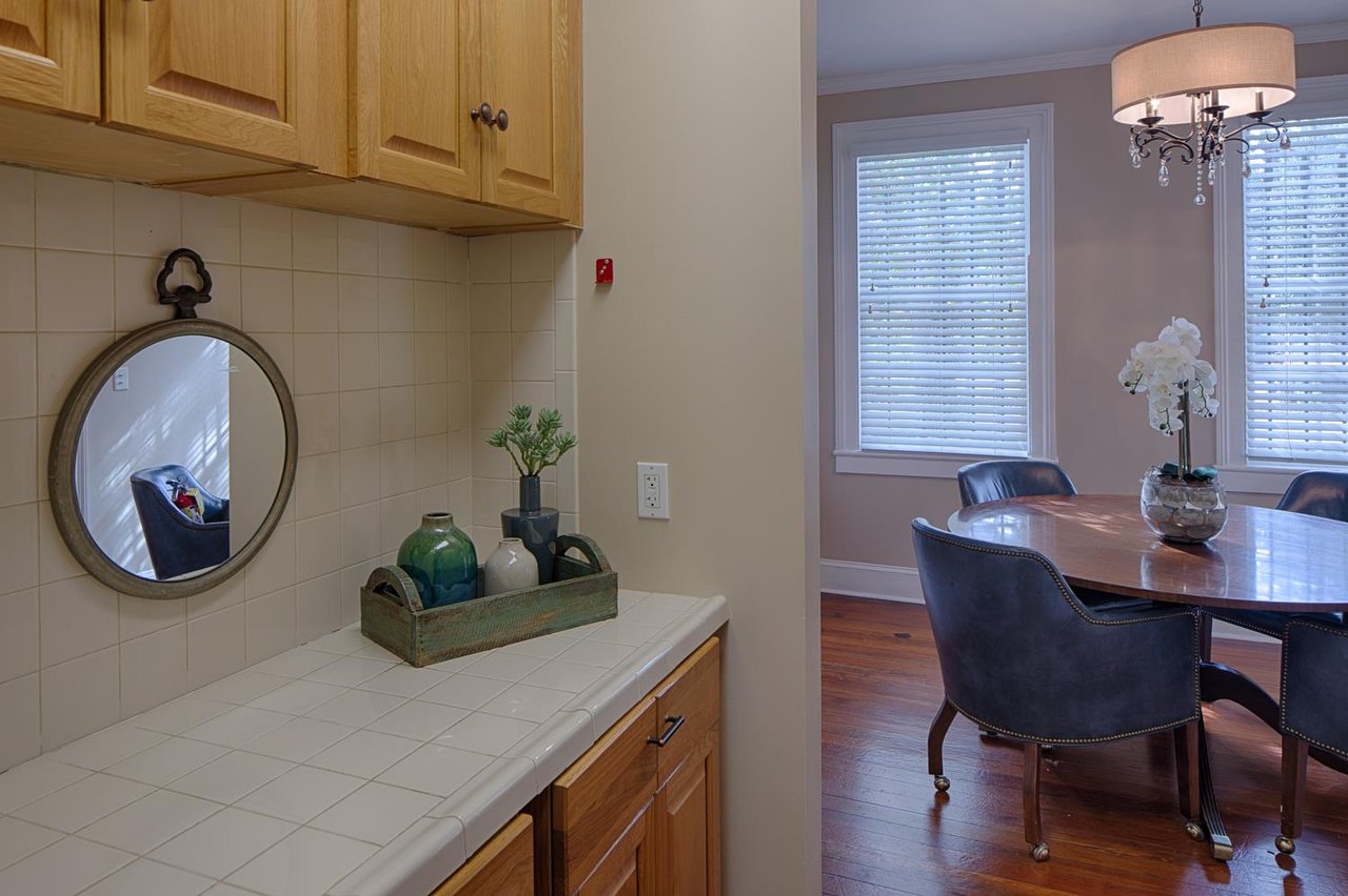 The butlers pantry leads to the dining room.