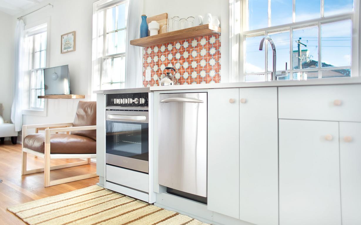 The full kitchen is adjacent to an eating nook for two.