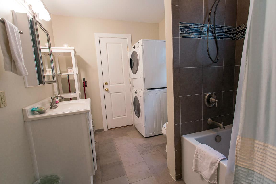 The second bath has a tubshower combo with stacking washer and dryer.