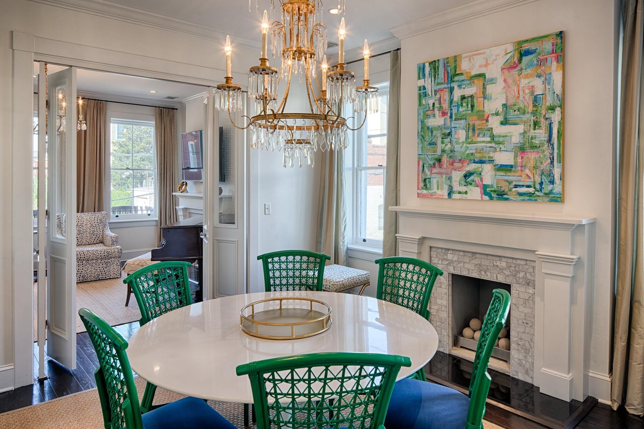 The antique chandelier is truly a statement piece for this grand room.