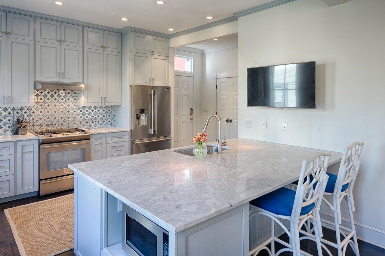 The cultured marble countertops compliment the custom cabinetry.