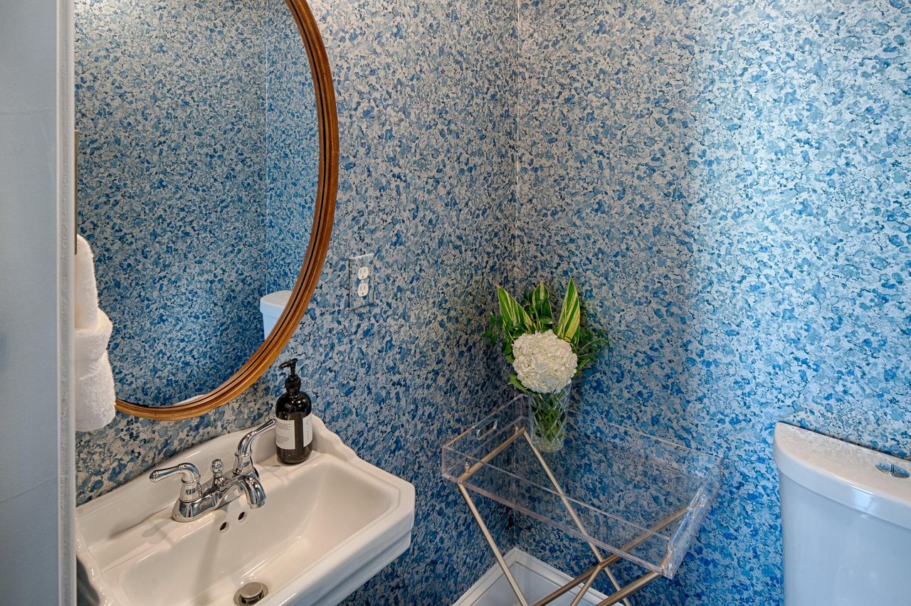 The main level additionally features a charming powder room.
