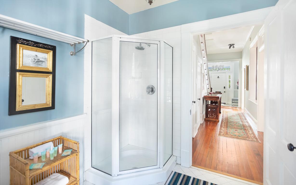 Just off of the kitchen guests can enjoy this fullsize bathroom, with walkin shower.