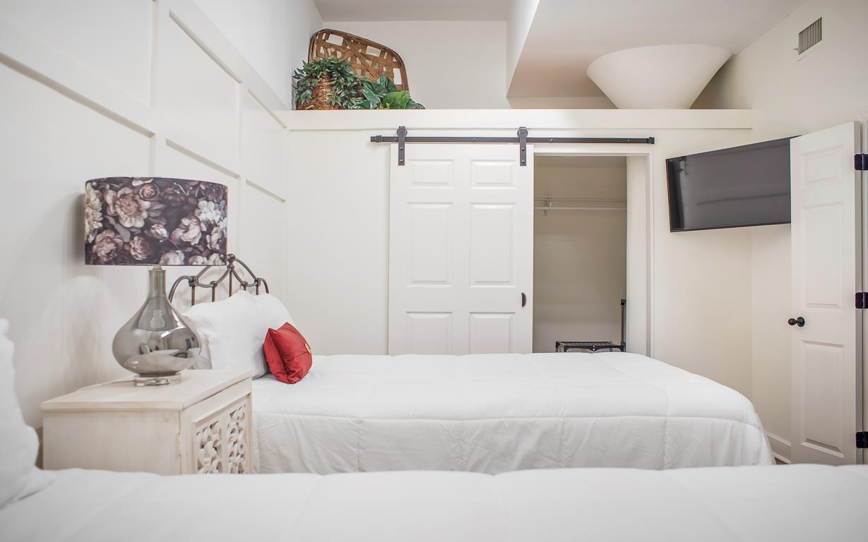 View of the hidden closet and flat screen TV.