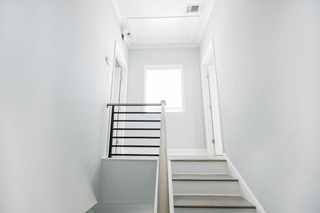 Atop of the stairs you will find split bedrooms.