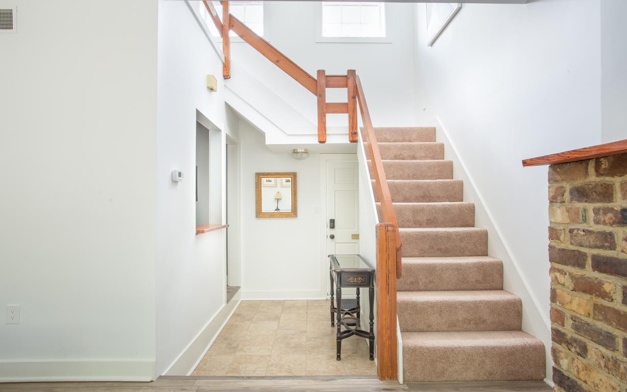 The bed and bath are located up the stairwell.