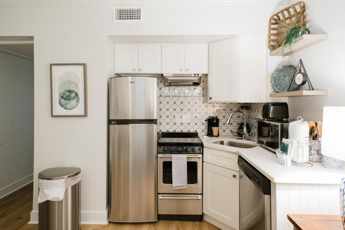 Mosaic tile is carried up to the ceiling to keep the design flowing.
