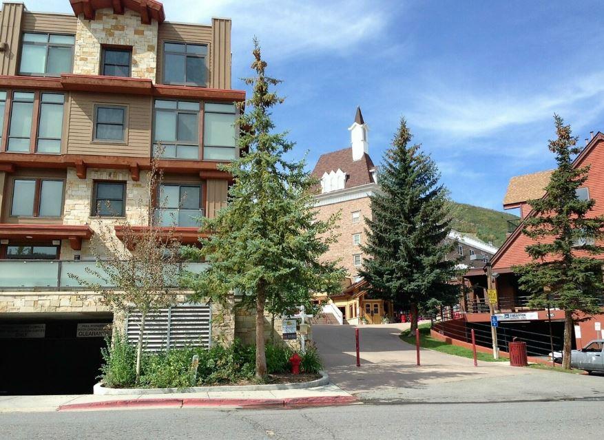 Parking garage at The Lowell left, our building, Silver Mill House, center