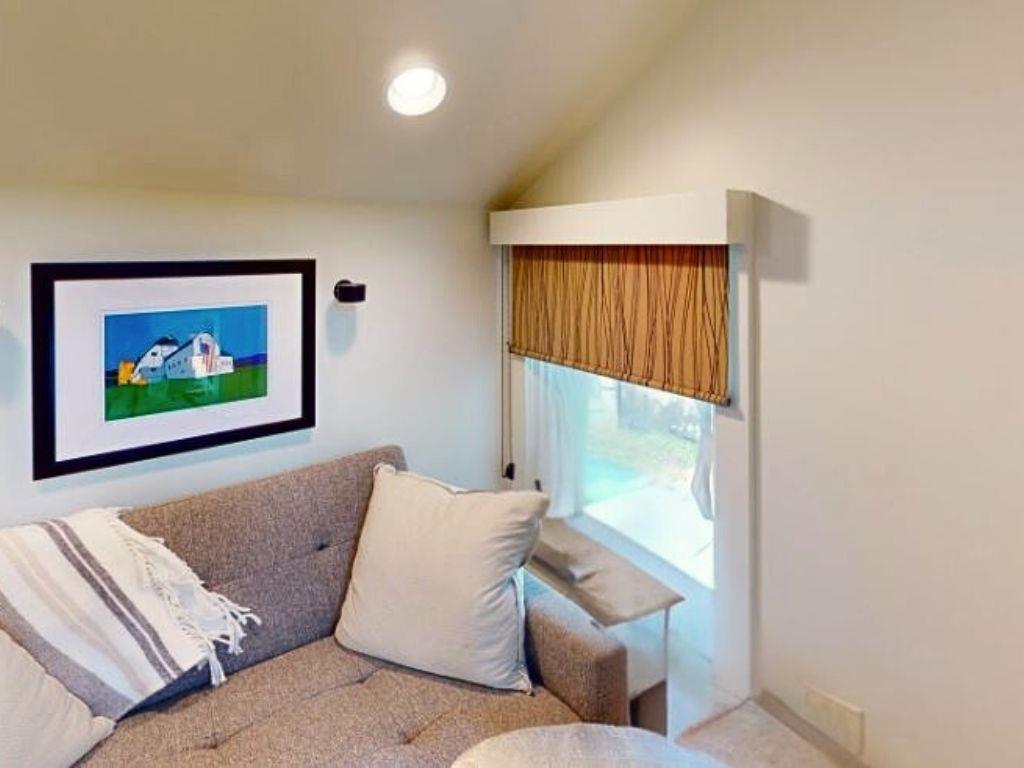 Upstairs sleeping nook with pull out sleeper chair.