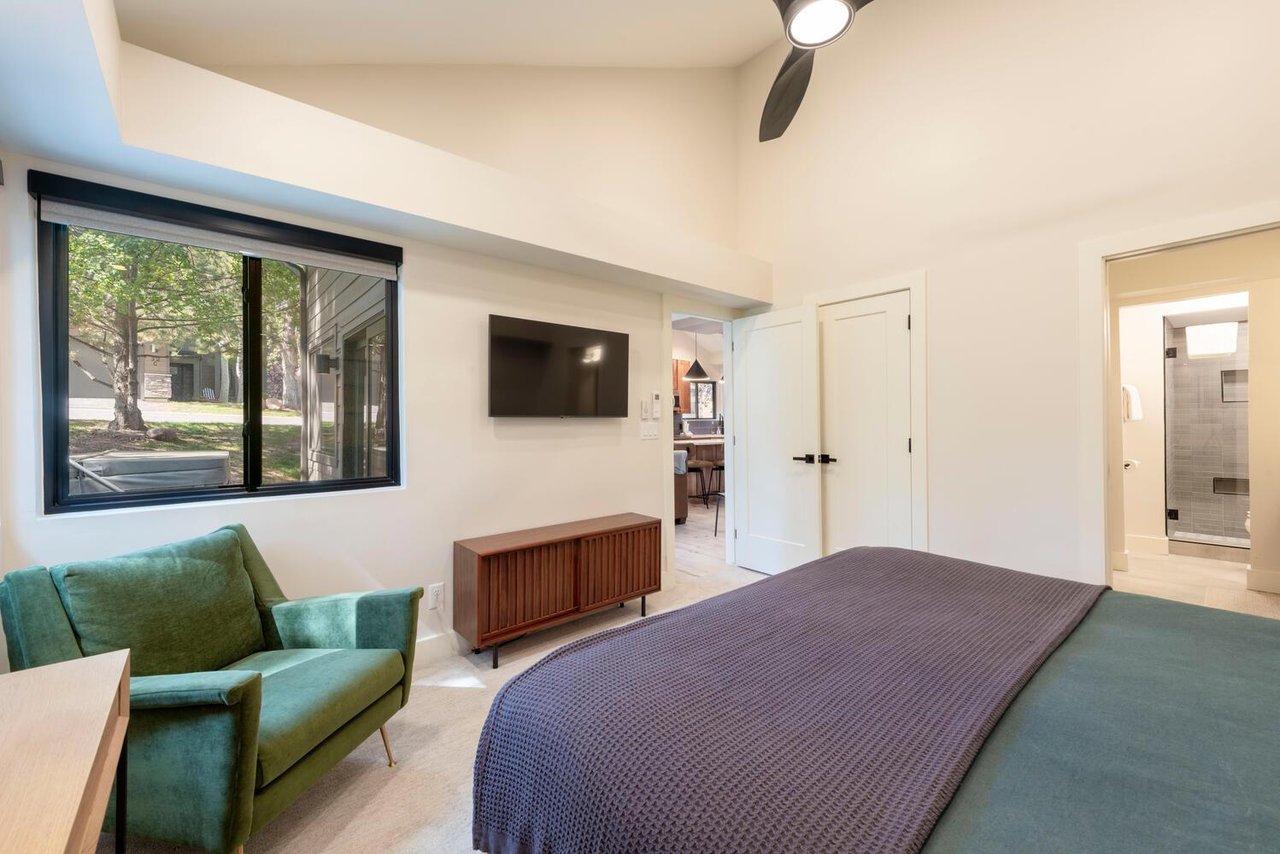 Comfortable master suite with TV and king bed