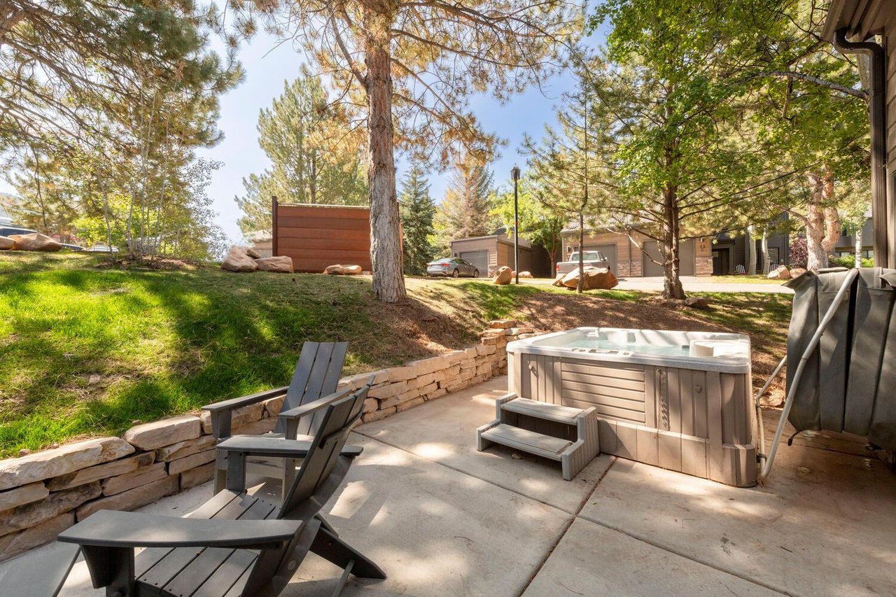 Patio with firepit and hot tub  perfect for family gatherings.