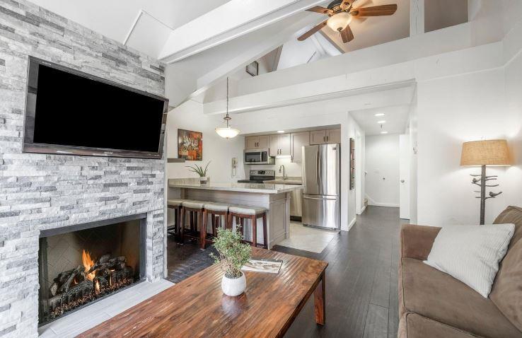 Warm fireplace, open kitchen, and vaulted ceilings make Lodge at Mountain Village 303 the perfect skiinskiout retreat at Park City Resort.