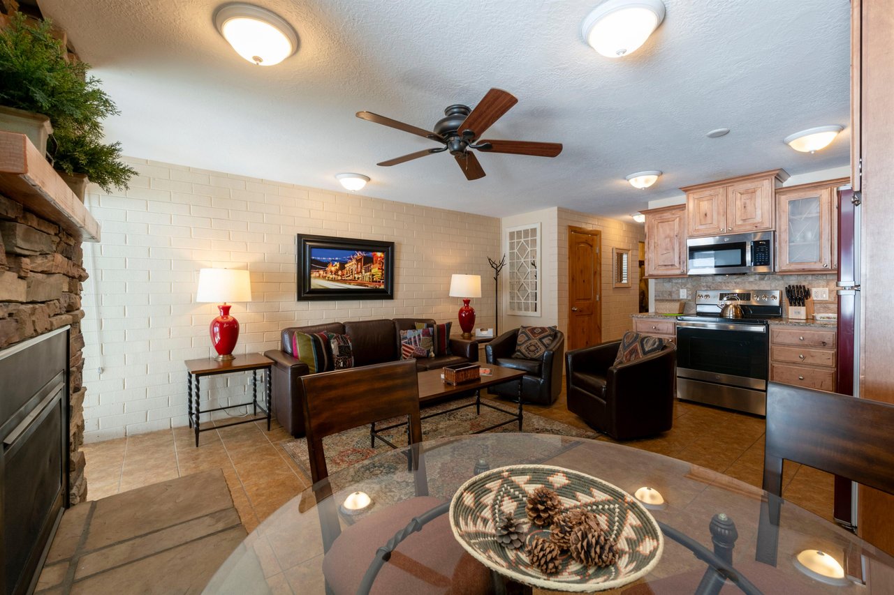 Sofa sleeper, flatscreen TV, and a bright open layout make the living area at Park Avenue 211 as functional as it is inviting.