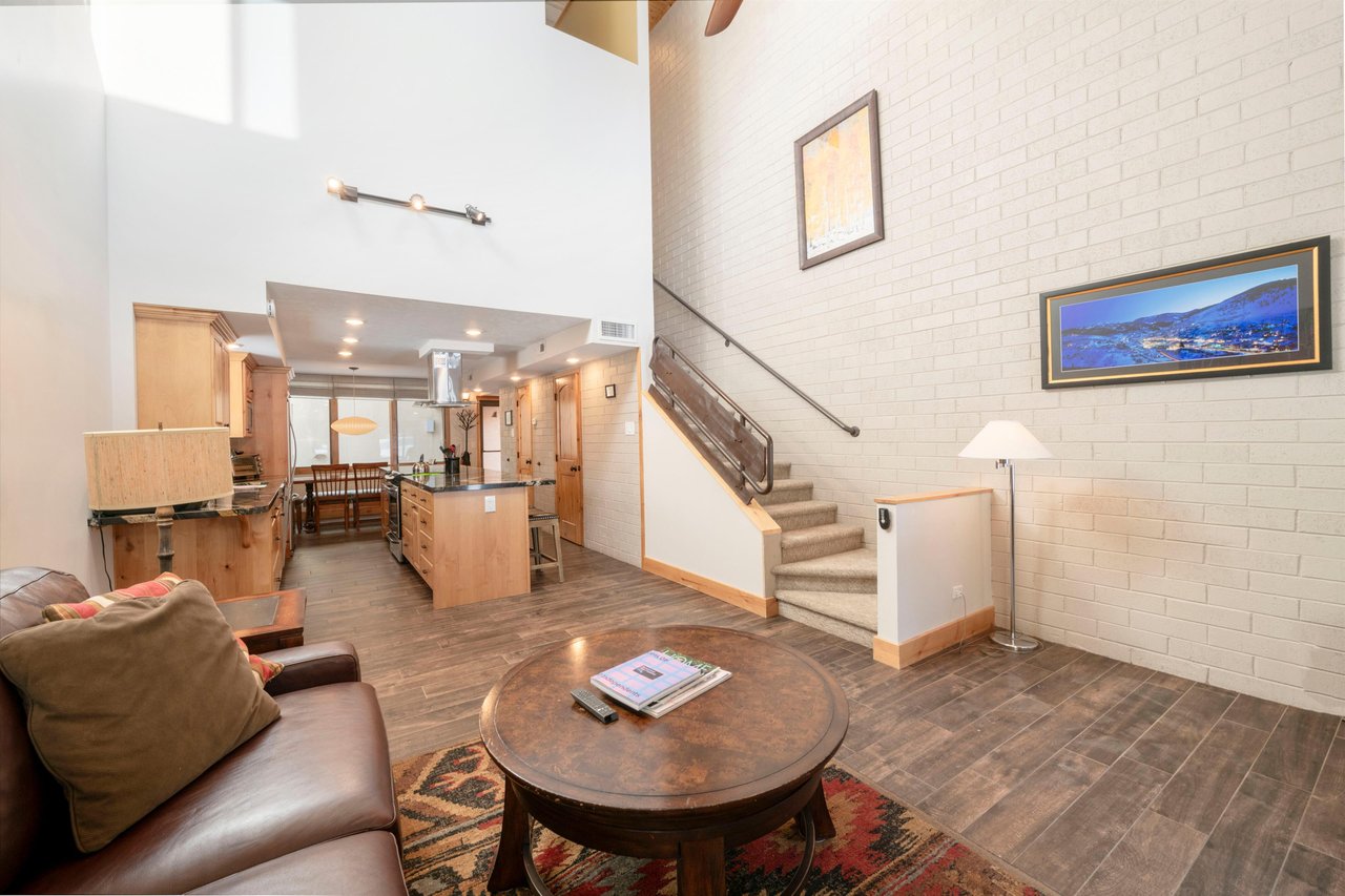 The beautifully remodeled main level at Park Avenue 235 features an openconcept living, dining, and kitchen layout — perfect for gathering with family and friends.