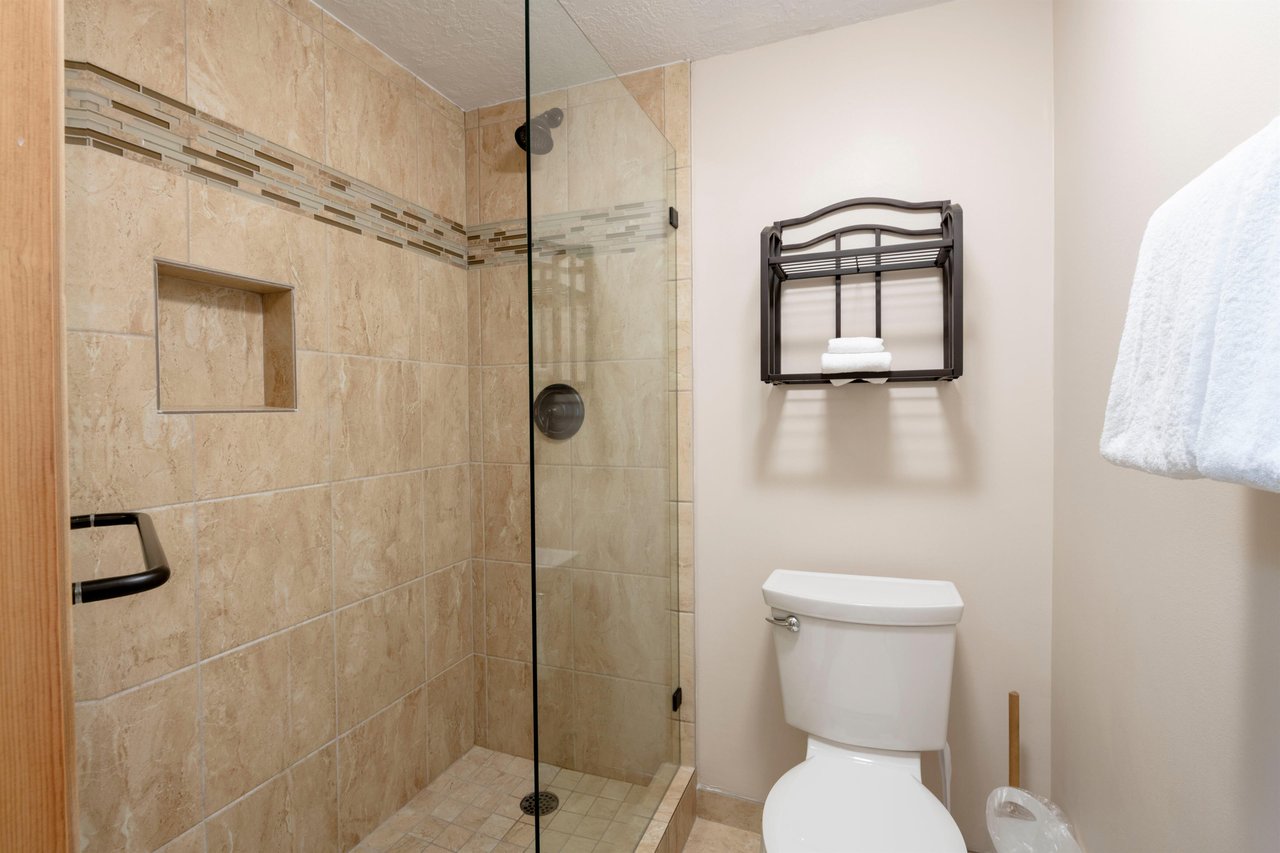 The spacious tiled walkin shower at Park Avenue 235 offers a relaxing way to refresh after a day on the slopes or trails.