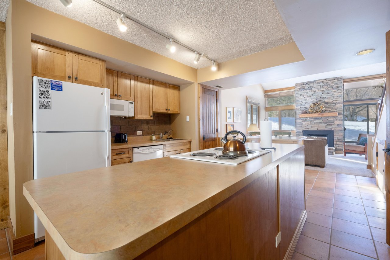 The kitchen at Park Avenue 224 keeps everything within reach — ample counter space, fullsize appliances, and an easy flow into the living area for stressfree meal prep at this Park City vacation ren