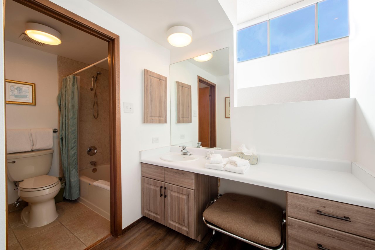 A bright, wellappointed bathroom with a vanity area to get ready in style — Park Avenue 216 thinks of everything.