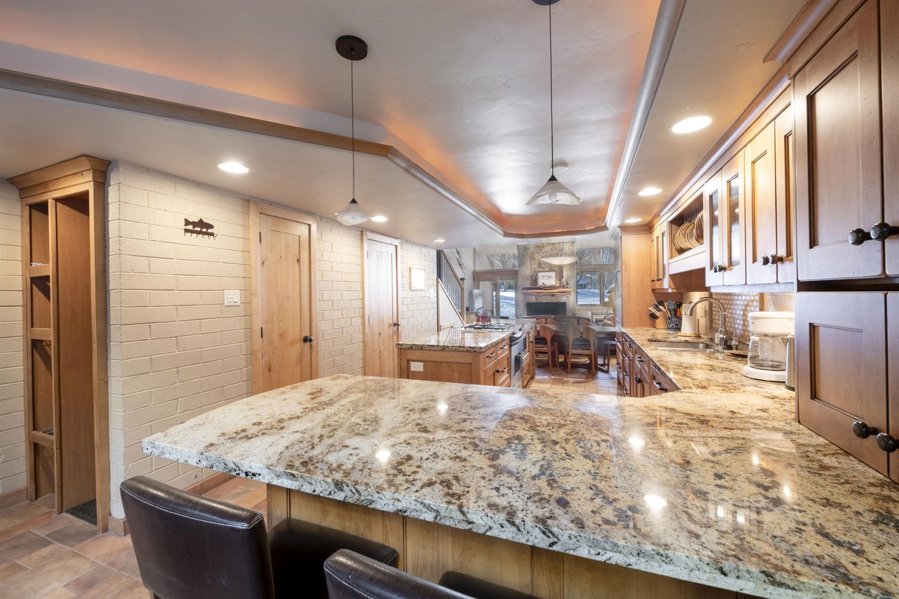 Pull up a barstool and pour a glass — the kitchen island at Park Avenue 227 is where the best Park City evenings begin.