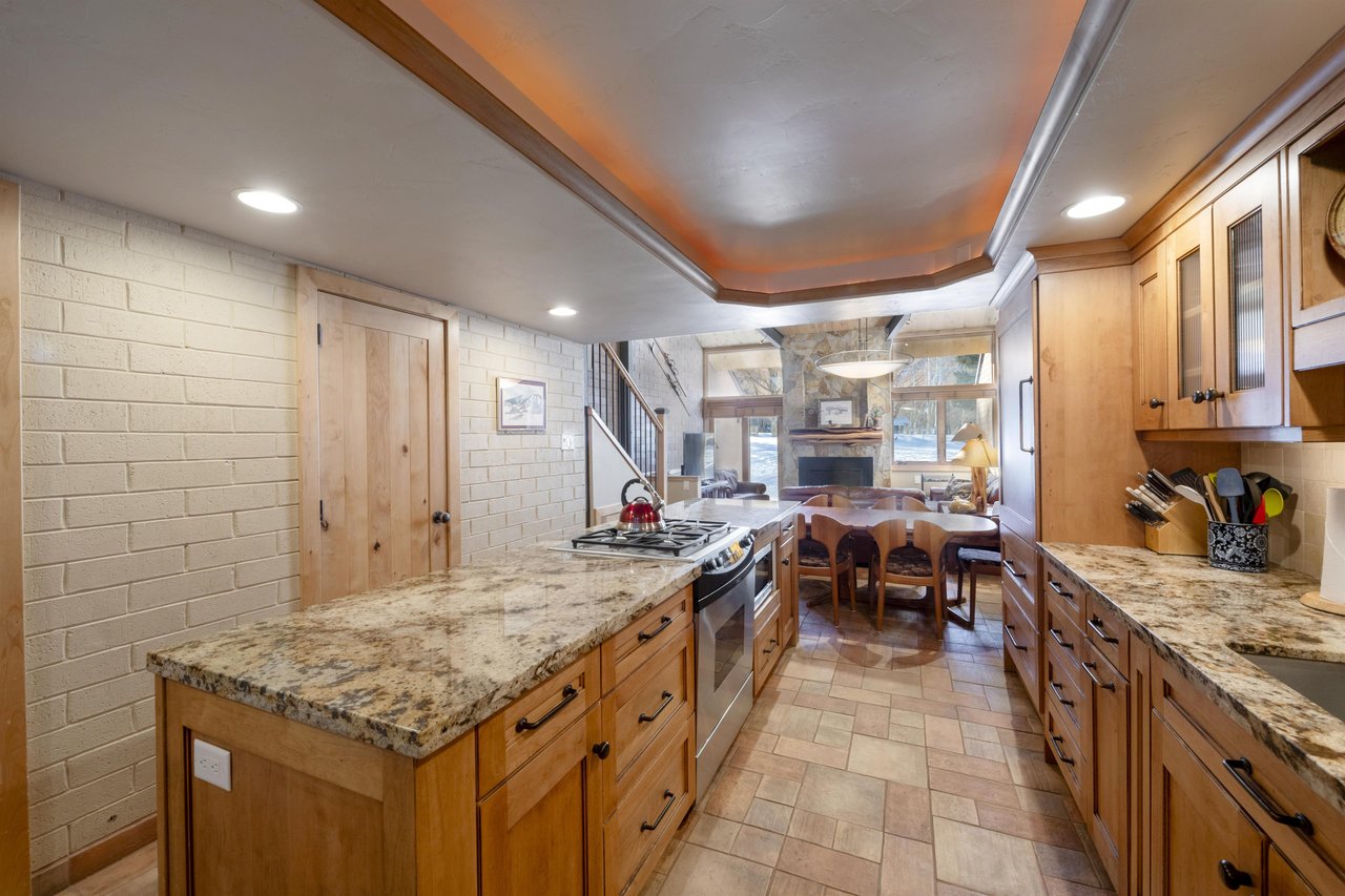 A fully equipped gourmet kitchen that flows seamlessly into the living space — entertaining at Park Avenue 227 has never looked so good.