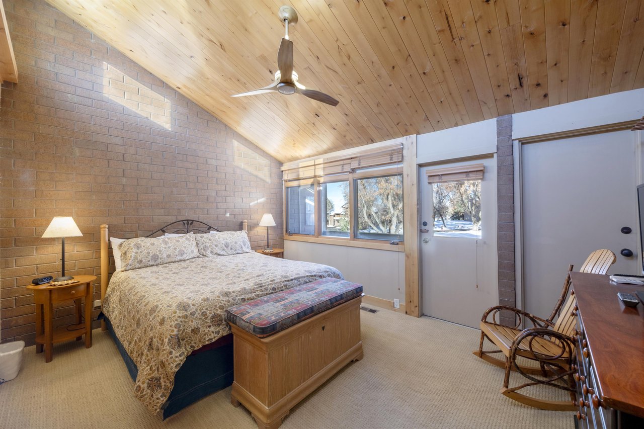Warm wood ceilings, natural light, and a peaceful retreat waiting at the end of every adventure — bedrooms at Park Avenue 227 are simply sublime.