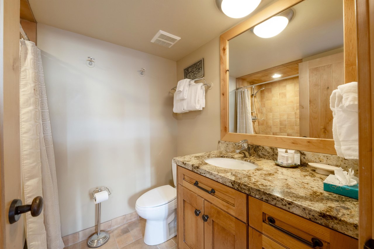 Granite counters, warm wood finishes, and fresh towels ready and waiting — Park Avenue 227 keeps every guest comfortable throughout their Park City lodging experience.