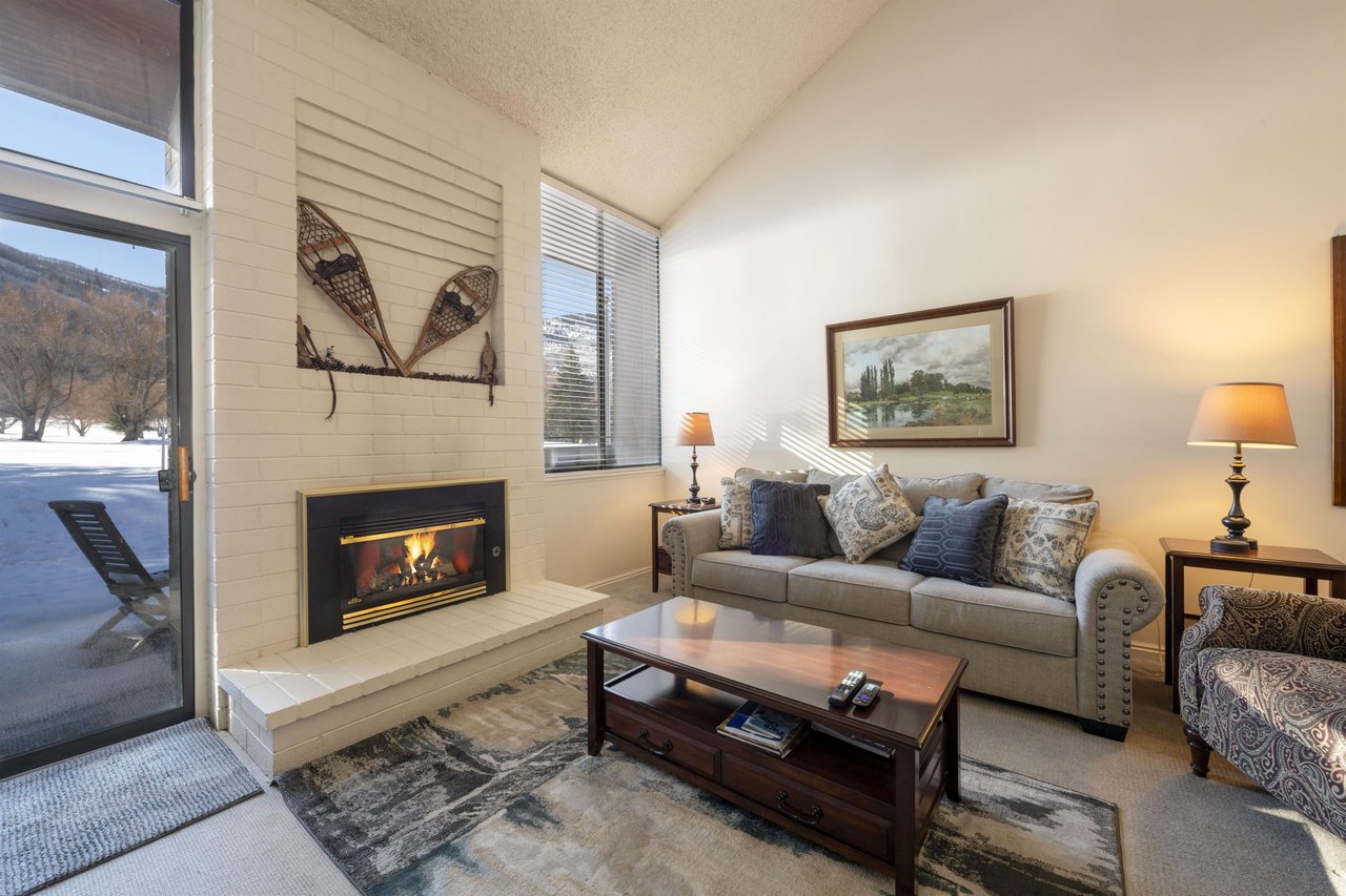 Curl up by the fireplace in the stylish and sunlit living room at Park Avenue 251 — where modern mountain comfort meets effortless charm for the ultimate Park City lodging experience.