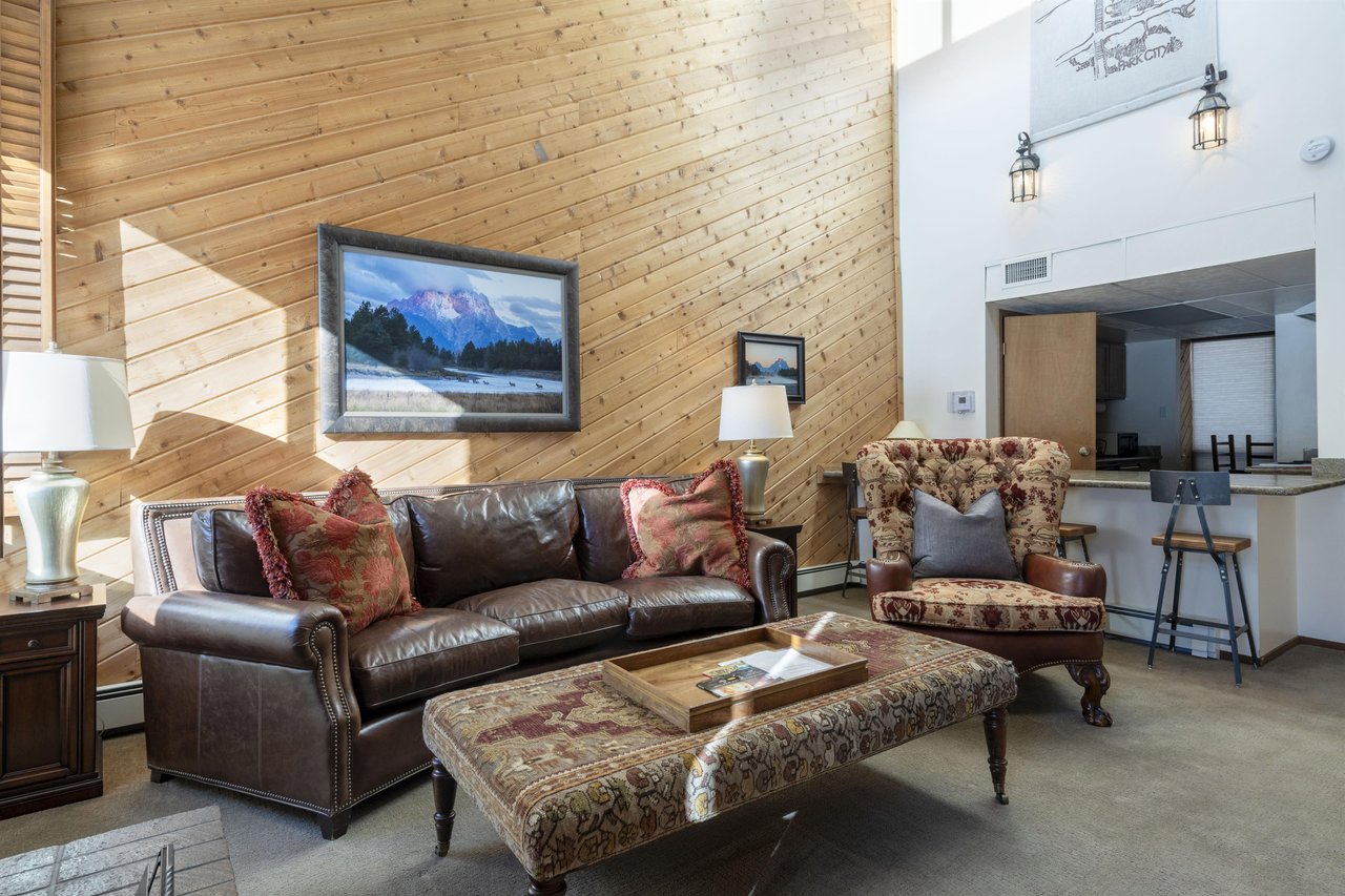 Grand in scale and rich in character, the stunning living room at Park Avenue 267 sets the stage for an unforgettable stay — the kind of bold mountain aesthetic that makes Park City vacation rentals h