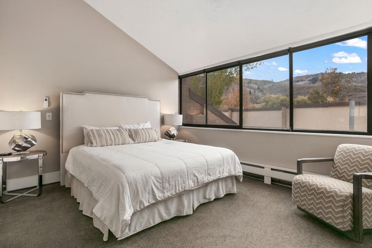 Wake up to breathtaking mountain views from the serene and elegantly appointed king bedroom at Park Avenue 296. Crisp white linens and a bright, airy atmosphere make this Park City vacation rental the