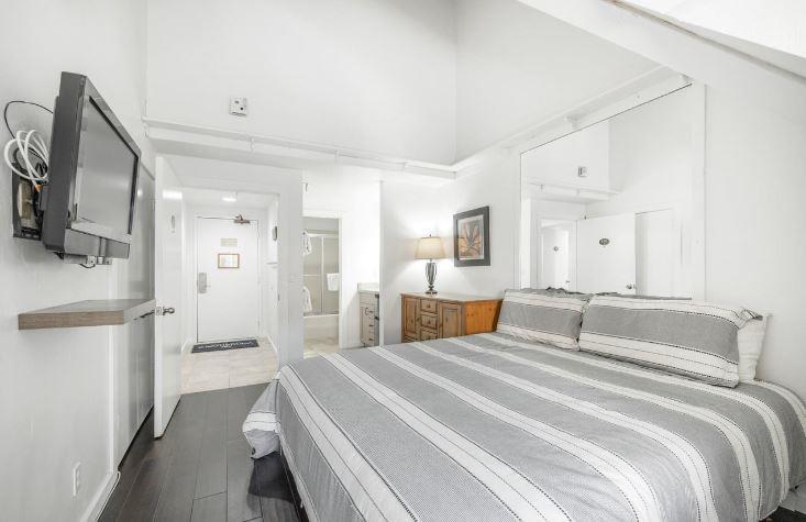 Natural light create a peaceful master bedroom escape at Lodge at Mountain Village 303, skiinskiout at Park City Resort.