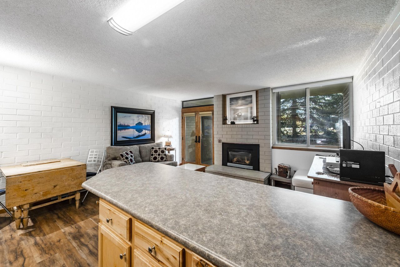 The open layout at Park Avenue 297 offers beautiful sight lines from the kitchen straight through to the cozy fireplace and living area. A warm and connected space that makes this Park City vacation r