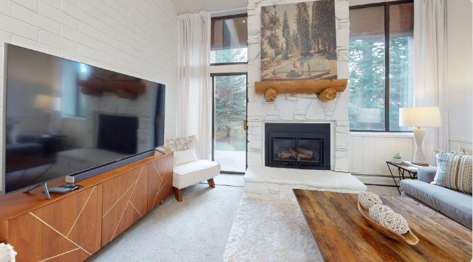 Cozy up by the fireplace at Park Avenue 299 and let the mountain views do the rest. This inviting living space perfectly captures the warmth and charm that makes this Park City vacation rental a guest