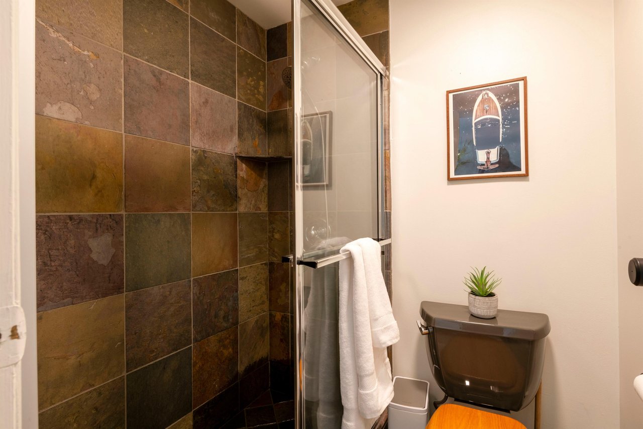 Relax and recharge in the beautifully tiled tubshower combo at Park Avenue 299. Rich slate tile and premium finishes bring a warm, spainspired feel to this Park City vacation rental.