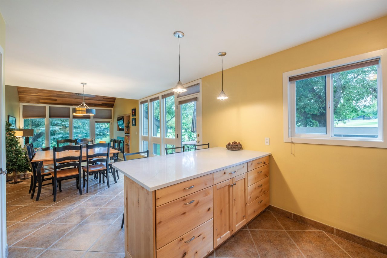 Cook, gather, and enjoy at Pay Day 183. This bright and spacious kitchen with a large island and dining area is everything you need in a Park City vacation rental — perfect for fueling up before hitti