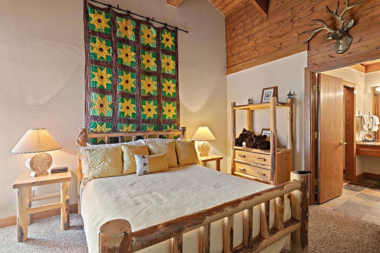 Every bedroom tells a story at 1296 Pinnacle, and this cozy queen room with rustic log furnishings and unique décor makes this Park City condo rental a oneofakind mountain lodging experience.