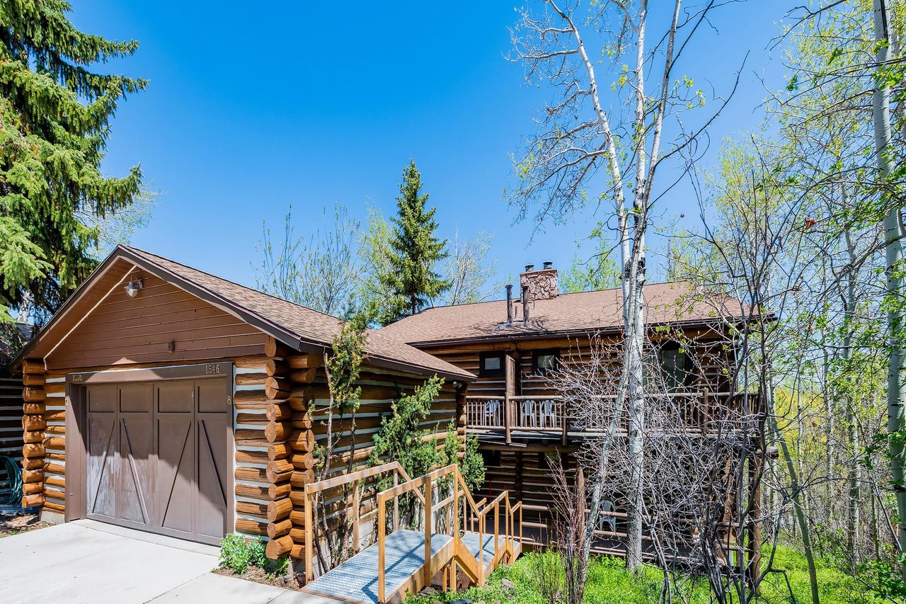 Nestled among mature trees and featuring authentic log exterior walls, Temptation 8 is a charming and iconic Park City vacation rental that perfectly captures the spirit of mountain lodge living in th